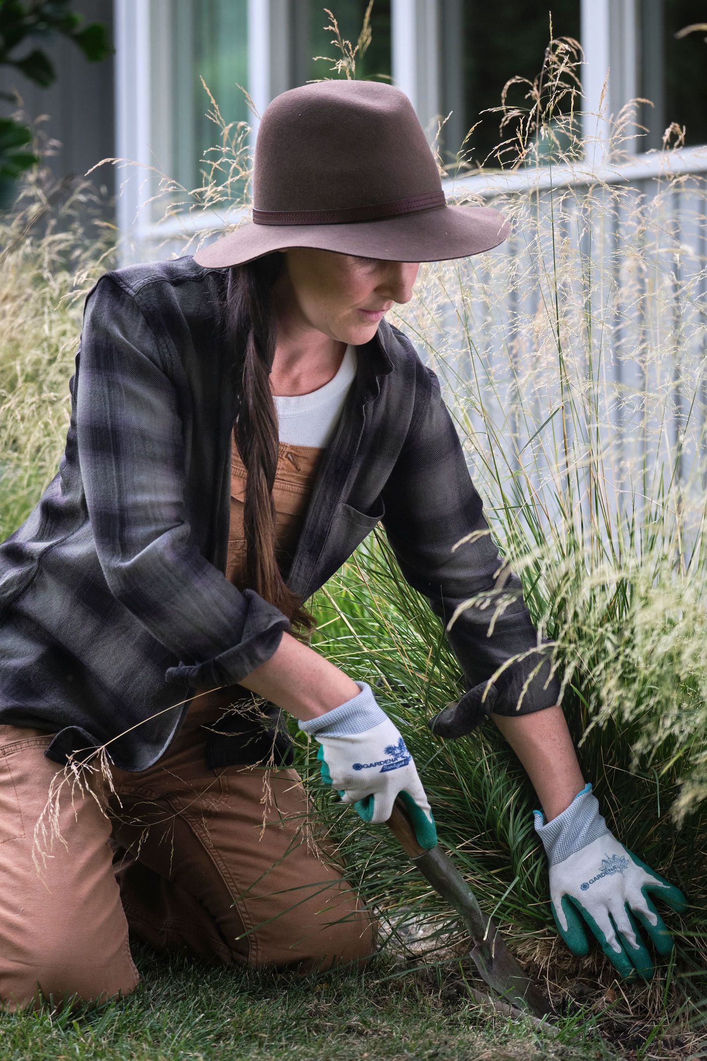 Hand-weeding a garden bed